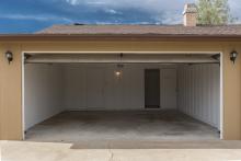 Attached garage with an open door.