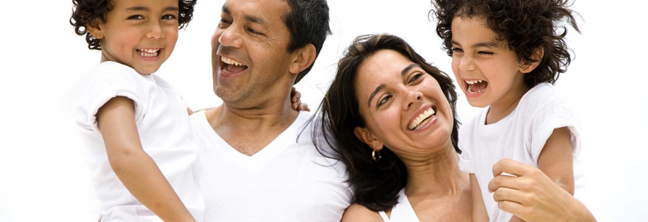 Parents with two children smiling