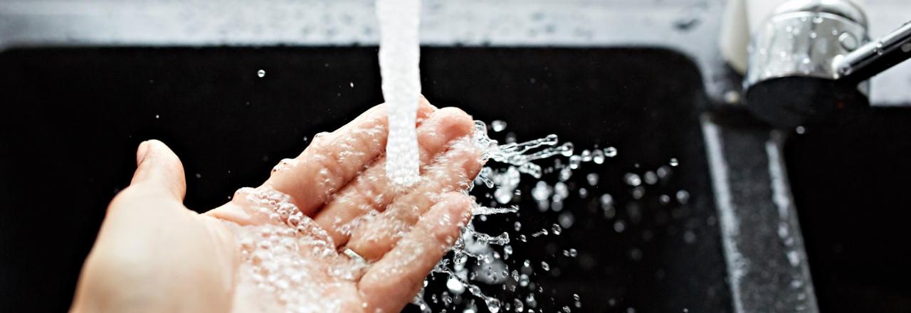 water running from a sink faucet