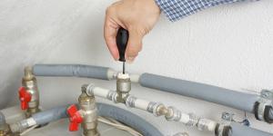 Technician repairing heating system 