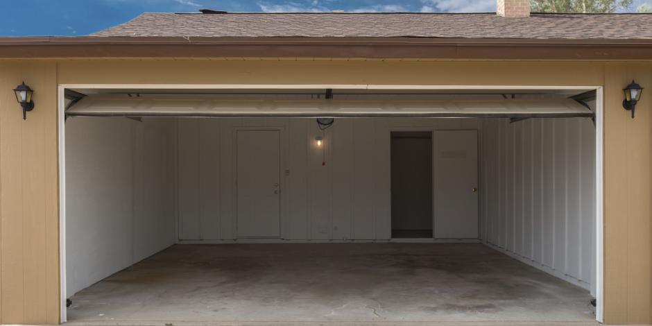 Attached garage with an open door.