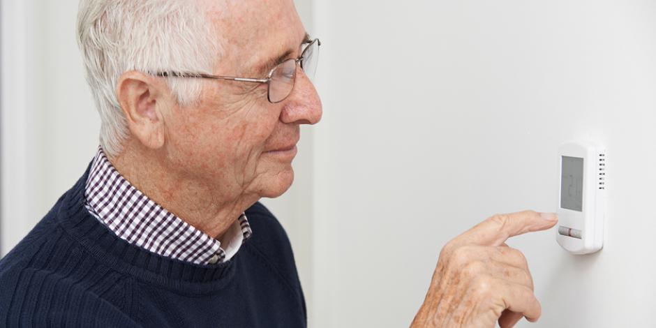 Older man setting thermostat Use this troubleshooting checklist if your furnace won't start