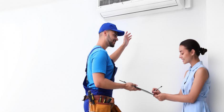 Technician speaking with woman