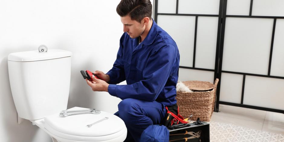 Man fixing toilet