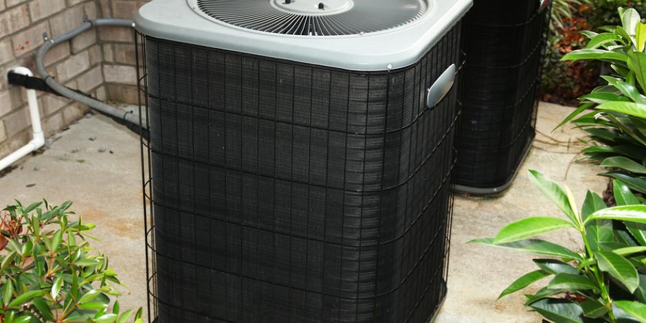 Outdoor air conditioning unit near home Outdoor air conditioning unit on cement