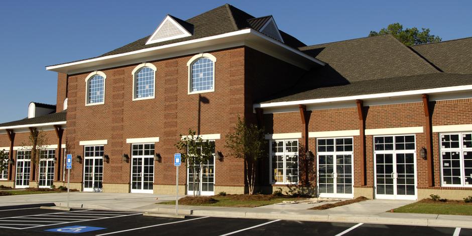 Parking lot outside of brick building